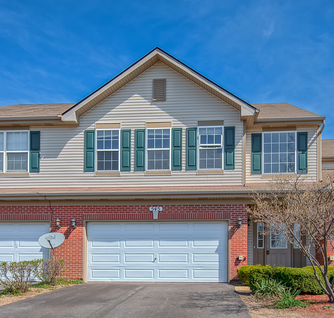 545 North Fox Trail Round Lake, IL 60073 - Photo 1 of 15 a front view of a house with garage