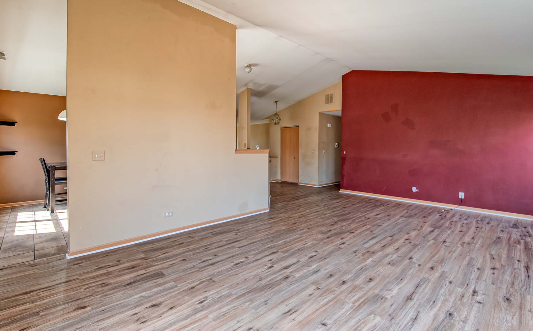 545 North Fox Trail Round Lake, IL 60073 - Photo 6 of 15 a view of an empty room with wooden floor and a window