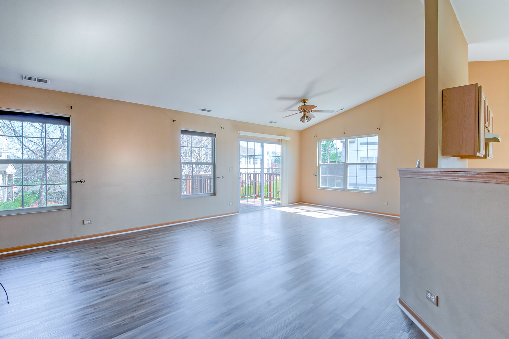 545 North Fox Trail Round Lake, IL 60073 - Photo 7 of 15 an empty room with wooden floor and windows
