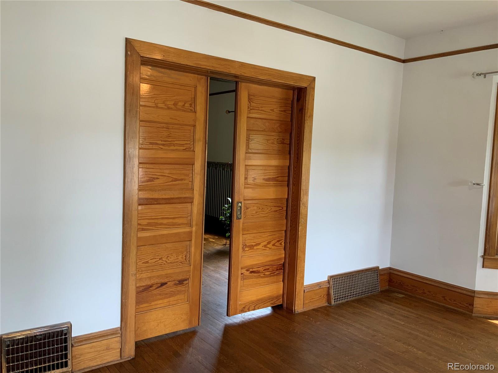 1011 Main Street Meeker, CO 81641 - Photo 20 of 28 a view of an empty room with wooden floor