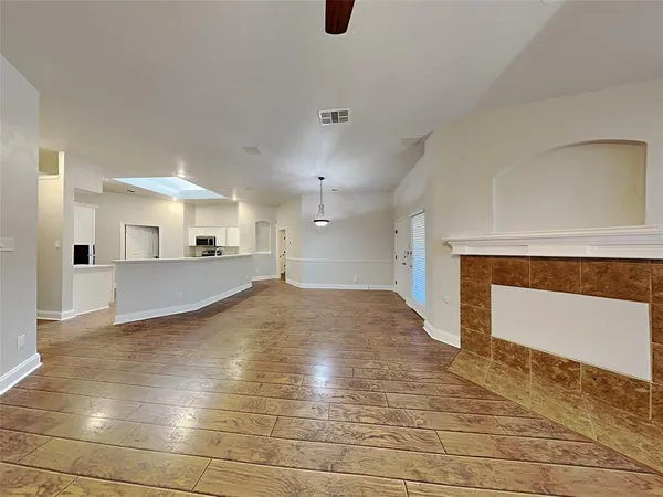 a view of a kitchen with a sink and cabinets