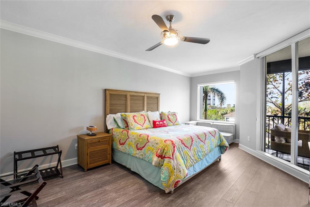 8720 Bay Colony Drive, Unit 304 Naples, FL 34108 - Photo 9 of 18 a bedroom with a bed and a window