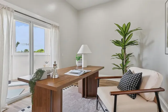 a view of a workspace with furniture