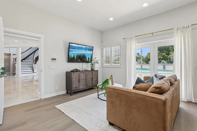 a living room with furniture and a flat screen tv