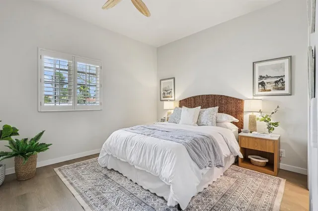 a bedroom with a large bed and a couch