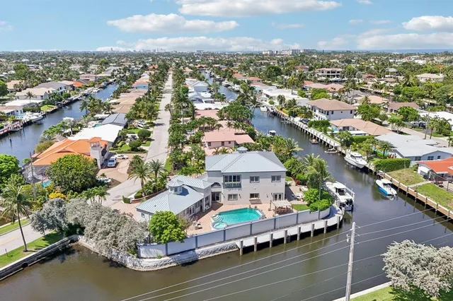 an aerial view of a house with a table and chairs