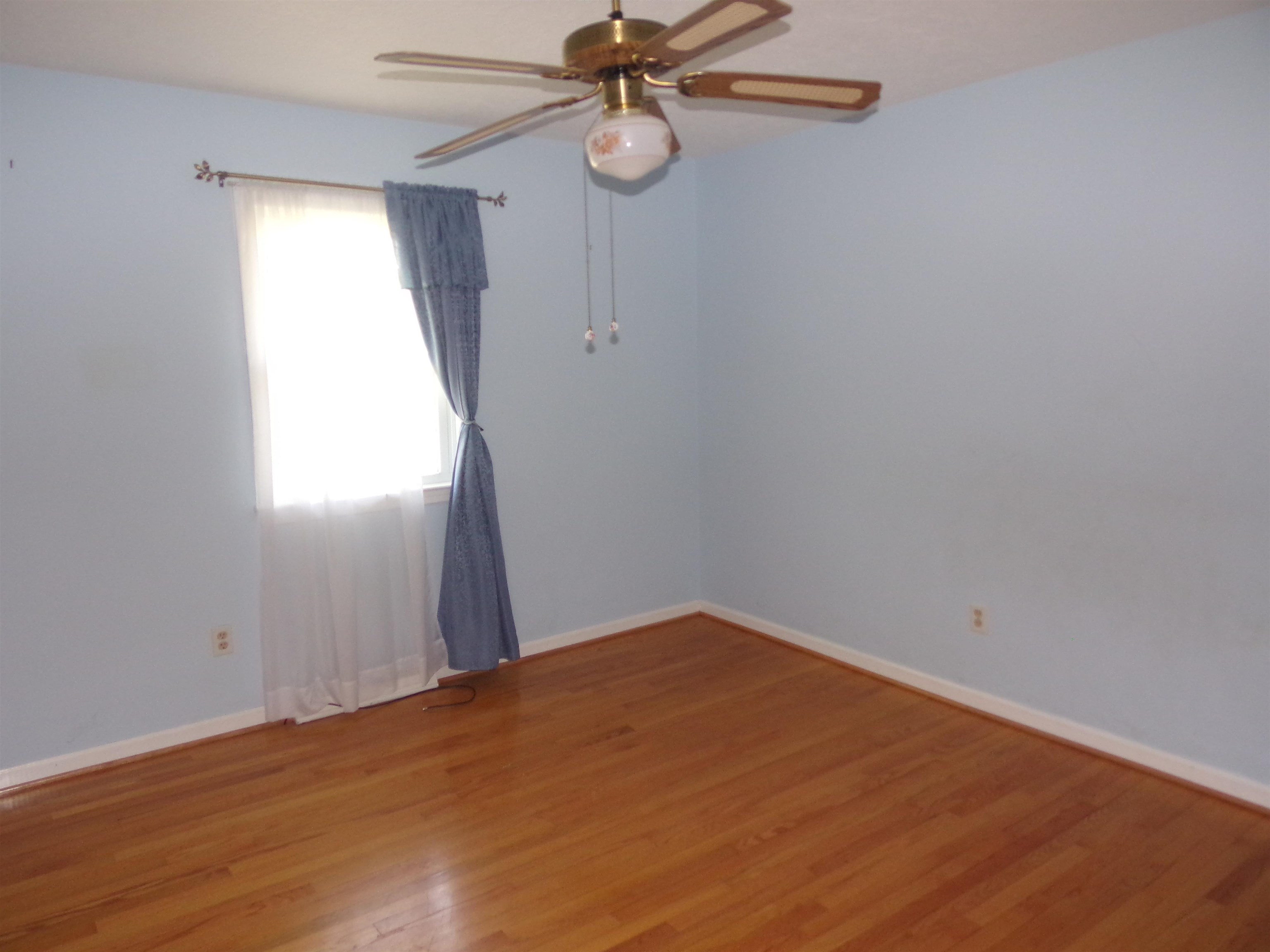 1728 Rockfish Road Waynesboro, VA 22980 - Photo 19 of 42 a view of empty room with wooden floor and fan