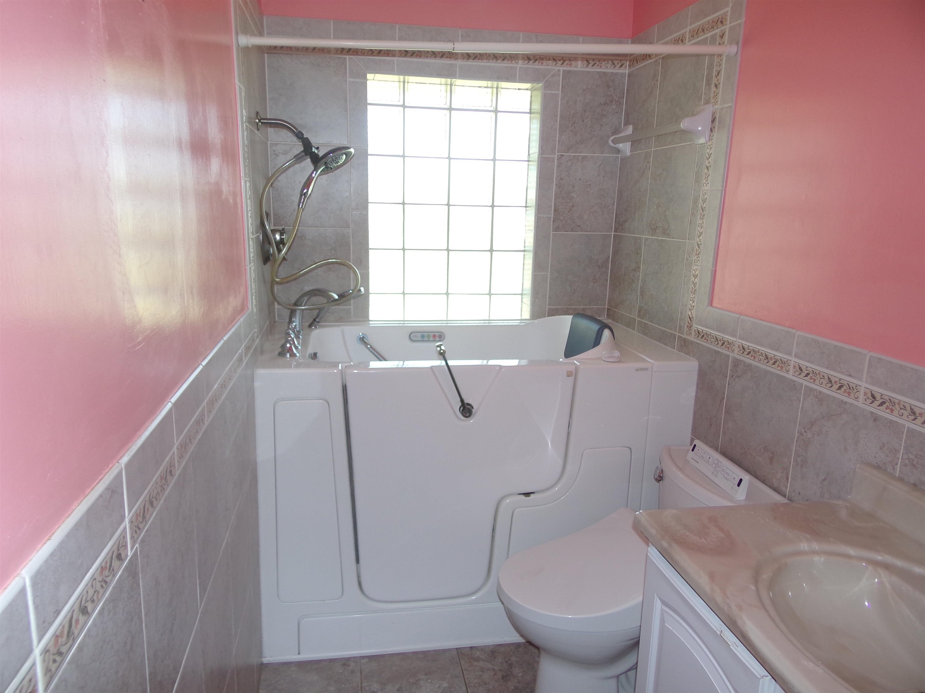 1728 Rockfish Road Waynesboro, VA 22980 - Photo 21 of 42 a bathroom with a sink toilet and window