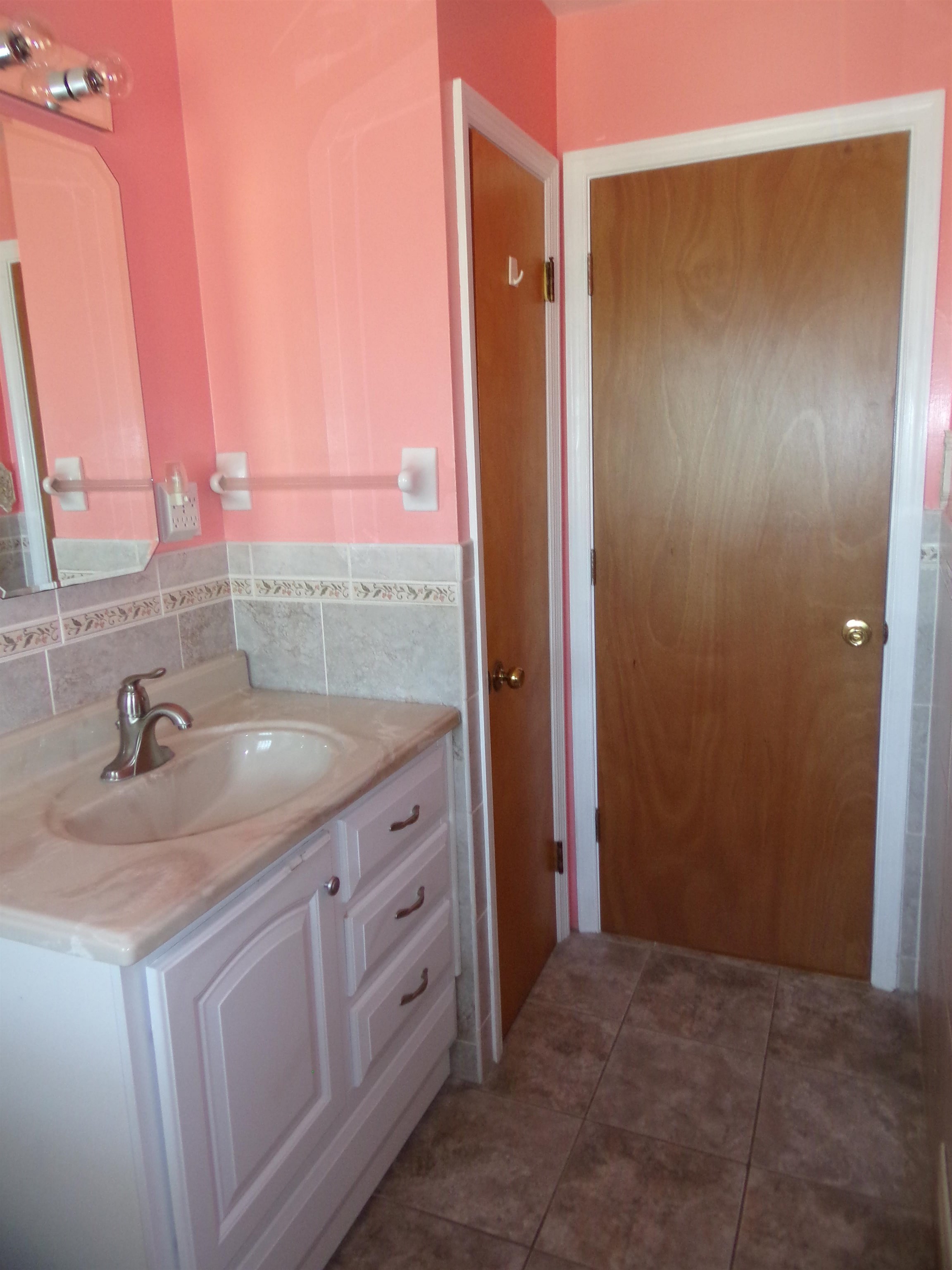 1728 Rockfish Road Waynesboro, VA 22980 - Photo 22 of 42 a bathroom with a granite countertop sink and a mirror