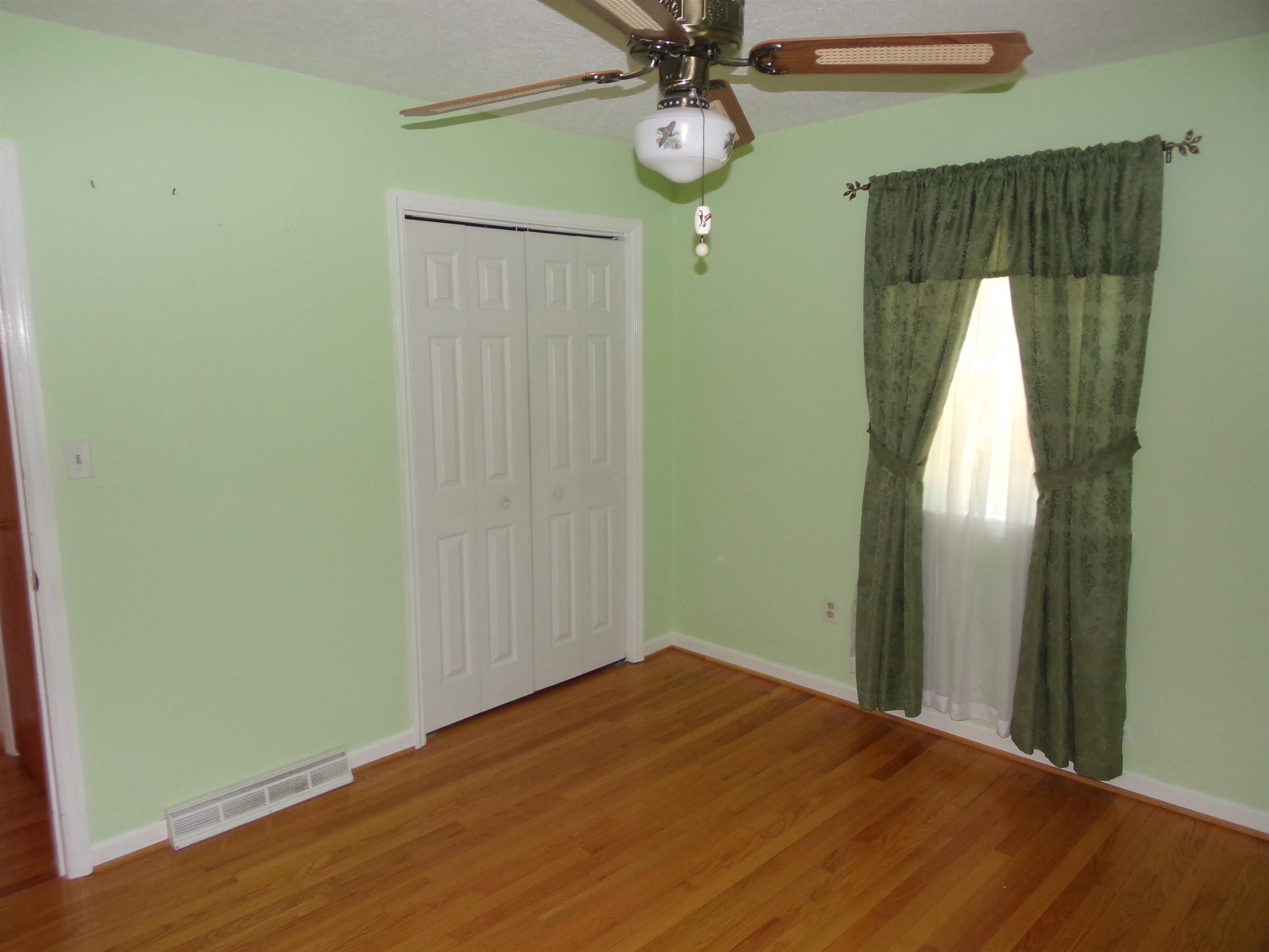 1728 Rockfish Road Waynesboro, VA 22980 - Photo 23 of 42 a view of empty room with wooden floor and fan