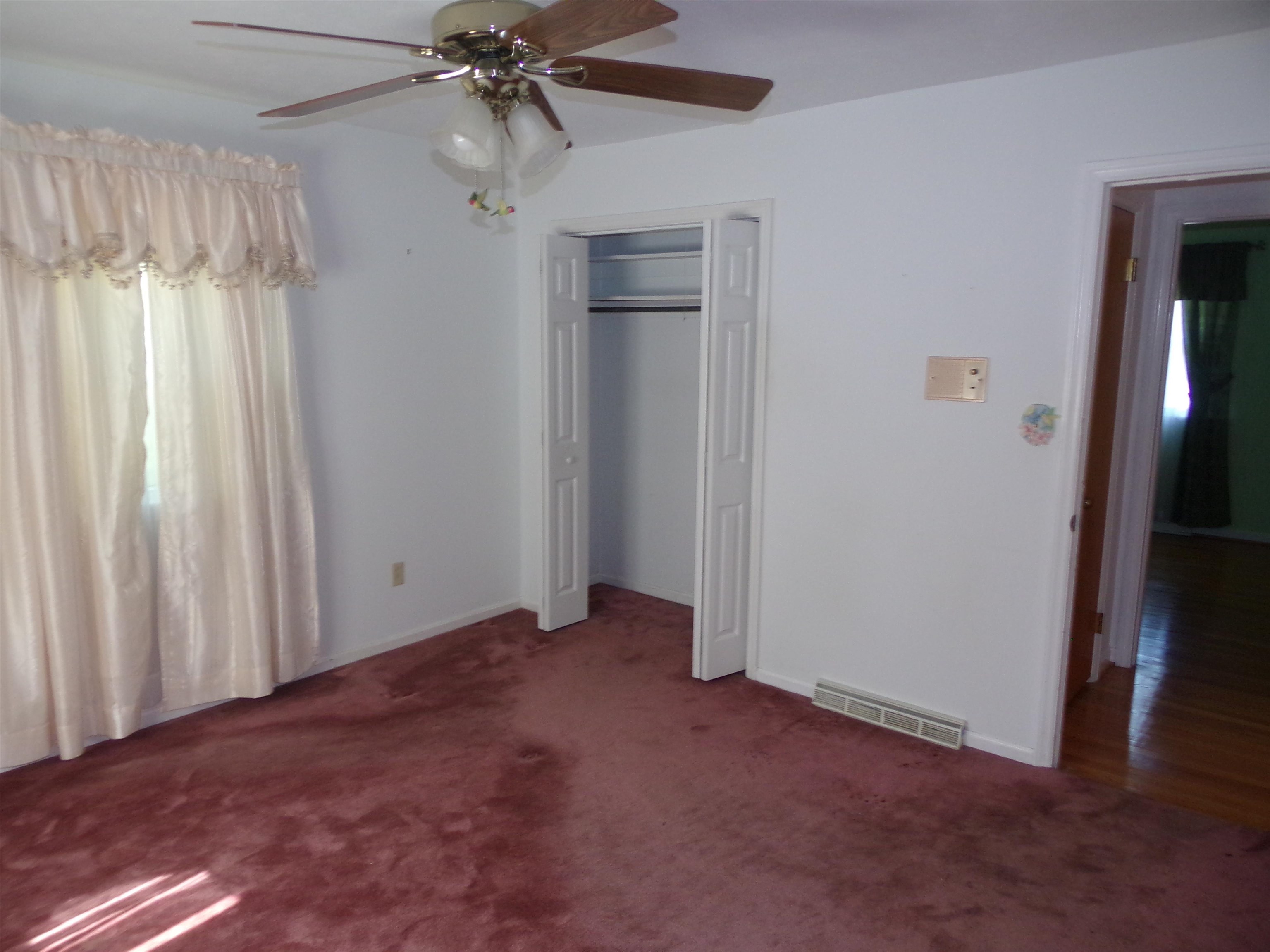 1728 Rockfish Road Waynesboro, VA 22980 - Photo 26 of 42 an empty room with windows and fan