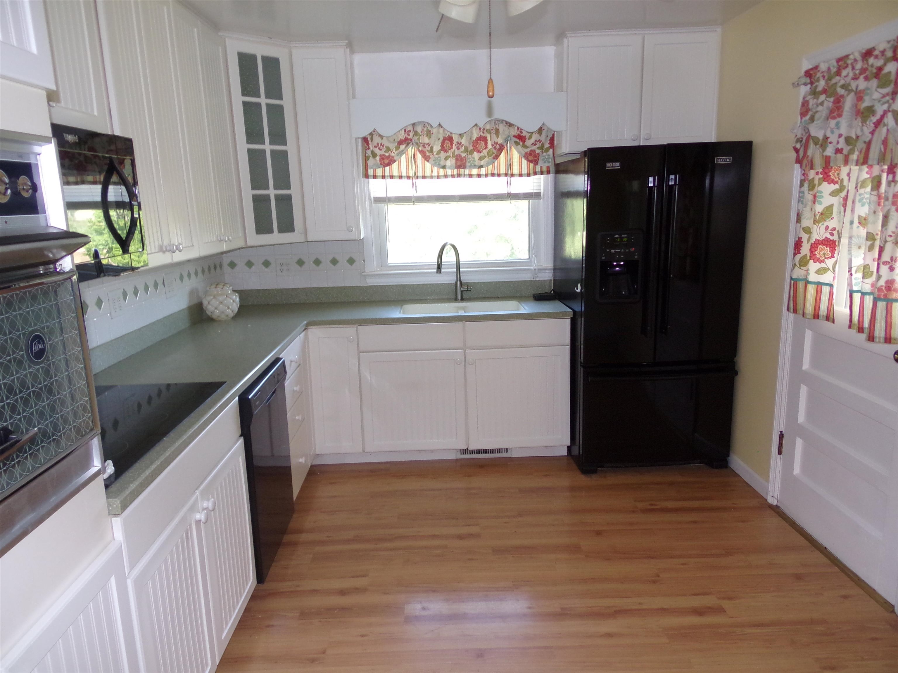 1728 Rockfish Road Waynesboro, VA 22980 - Photo 9 of 42 a kitchen with stainless steel appliances granite countertop a refrigerator and a sink