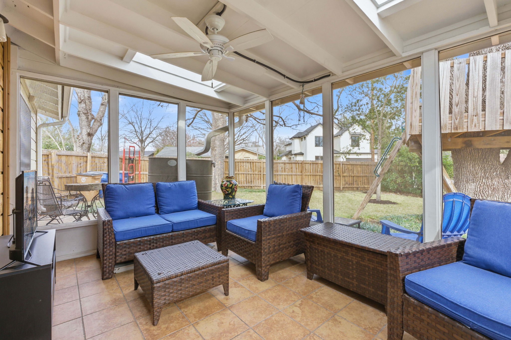 6809 Pioneer Place Austin, TX 78757 - Photo 28 of 33 a living room with furniture and a floor to ceiling window