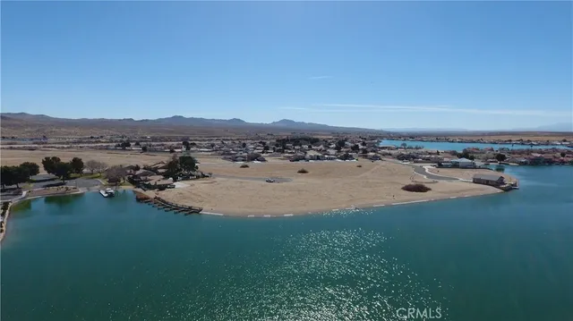 an aerial view of a house with a lake view