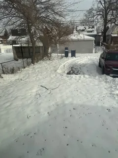 a view of a backyard of a house