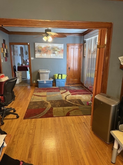 907 South 10th Avenue Maywood, IL 60153 - Photo 5 of 12 a bedroom with a bed and wooden floor