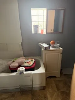 a bathroom with a sink and a window