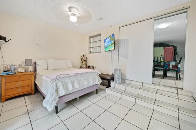 a bedroom with a bed and a table