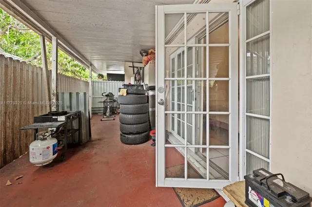 a room with gym equipment and a window