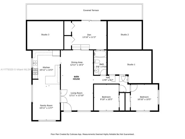 a view of a patio with table and chairs under an umbrella