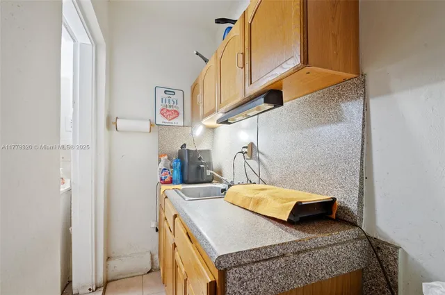a bathroom with a toilet a sink and a window
