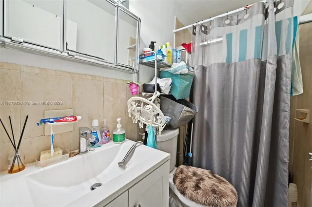 a kitchen with a refrigerator and cabinets