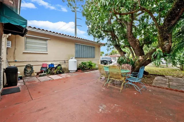 a bedroom with bed and a couch