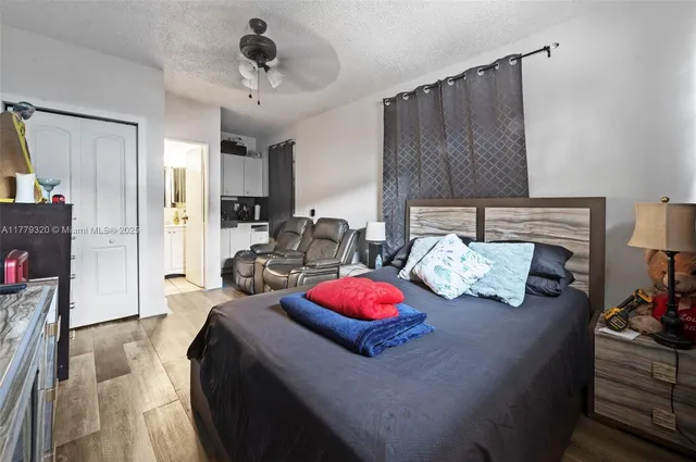 an aerial view of residential houses and car parked