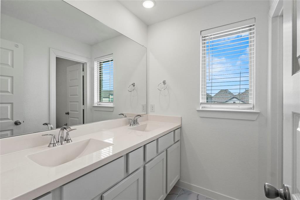 1805 Lockhart Drive Forney, TX 75126 - Photo 15 of 22 Full bathroom featuring double vanity and baseboards