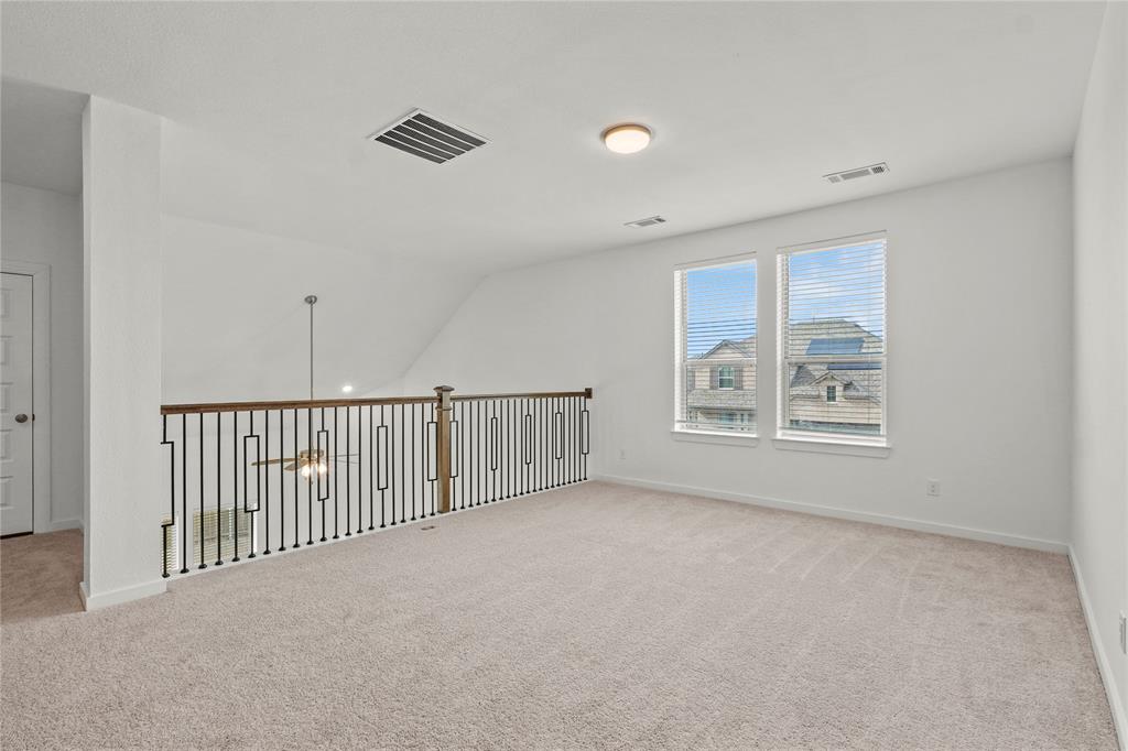 1805 Lockhart Drive Forney, TX 75126 - Photo 17 of 22 Spare room featuring light carpet and baseboards