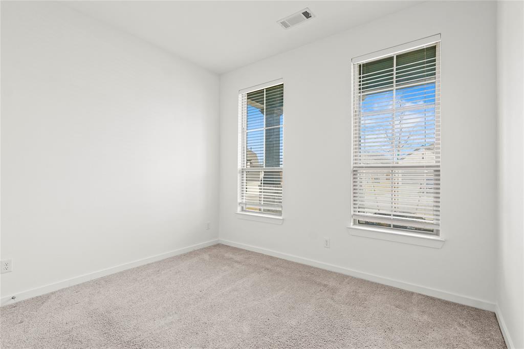 1805 Lockhart Drive Forney, TX 75126 - Photo 9 of 22 Spare room with light carpet and baseboards