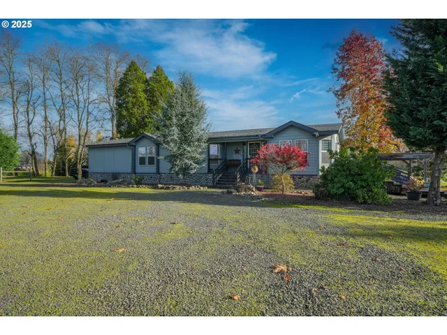 a front view of house with yard and outdoor seating