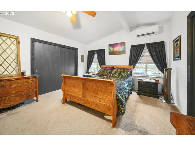 a bedroom with furniture and window