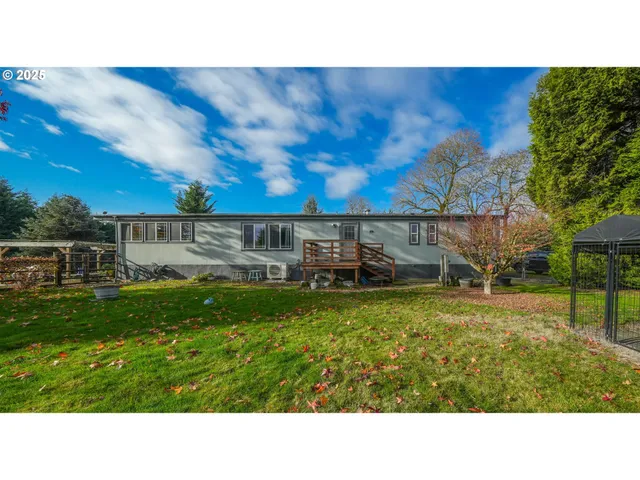 a view of a backyard with sitting area