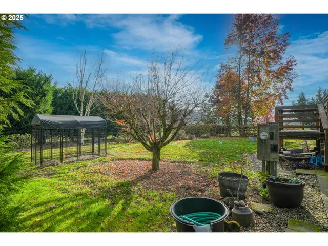 a backyard of a house with outdoor seating