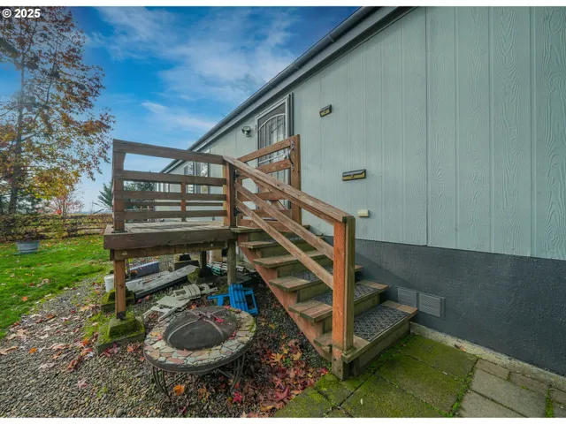 a backyard of apartments with large trees