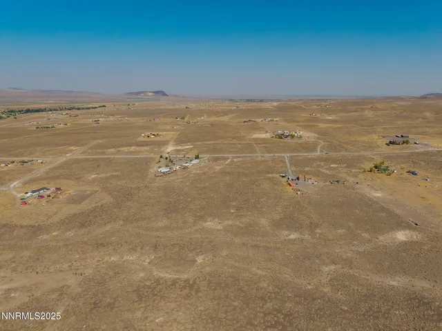 a view of an ocean beach and mountain