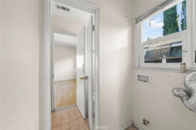 a view of a bathroom from the hallway