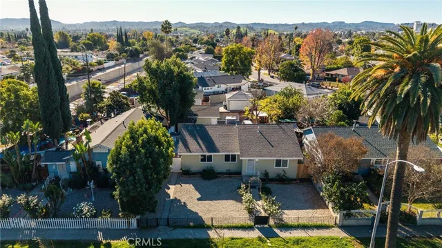 an aerial view of a house with a garden