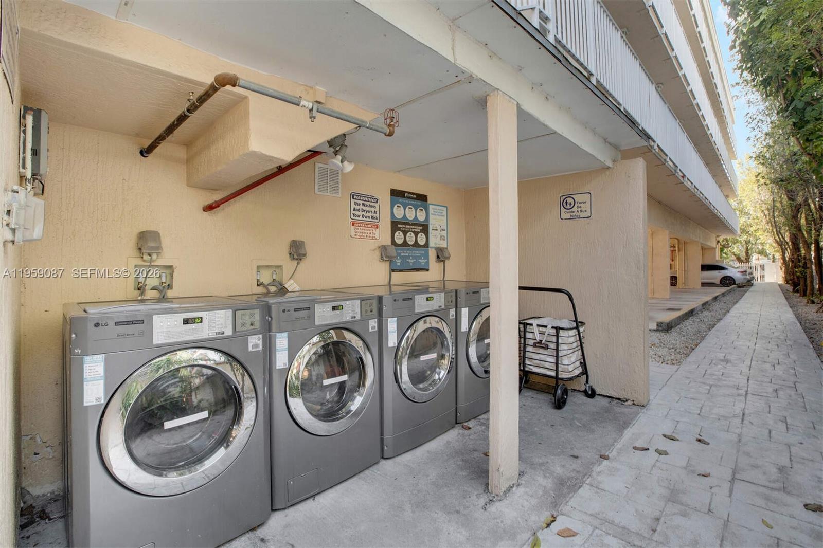 1349 Southwest 3rd Street, Unit 1 Miami, FL 33135 - Photo 8 of 8 a view of a storage & utility room with dryer and washer