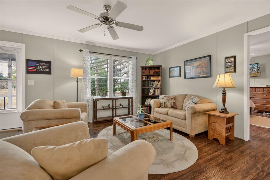 6249 South Esmeralda Terrace Lecanto, FL 34461 - Photo 14 of 61 a living room with furniture and a large window