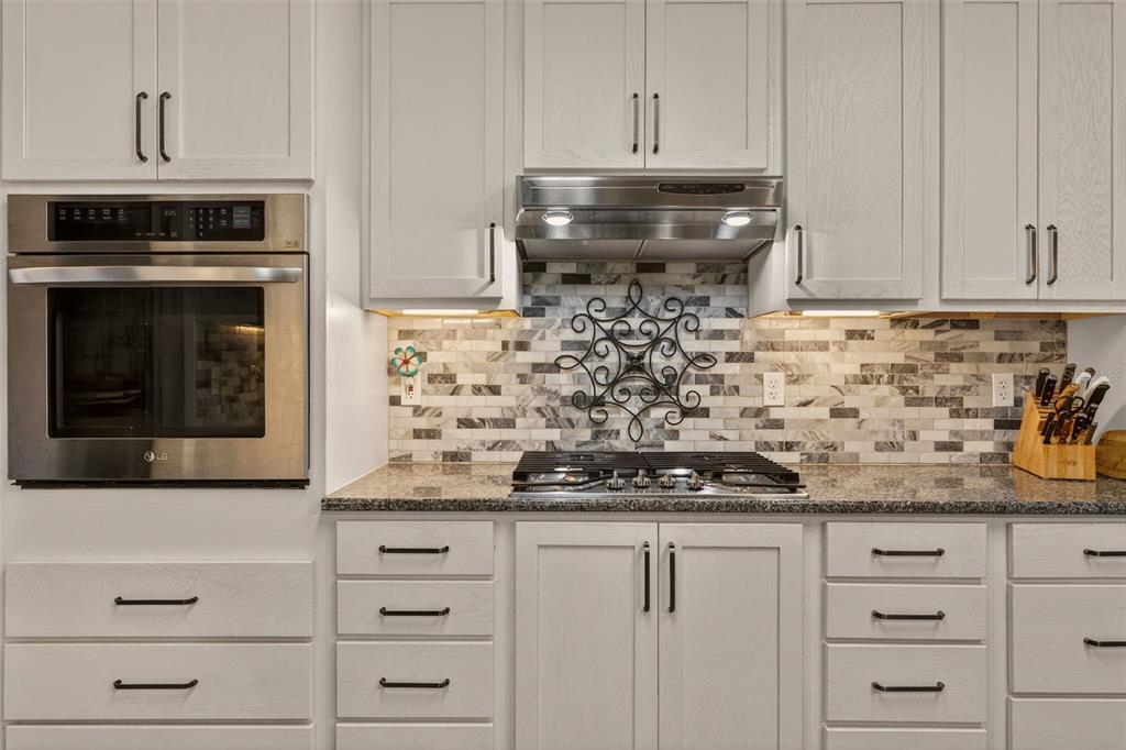 6249 South Esmeralda Terrace Lecanto, FL 34461 - Photo 18 of 61 a kitchen with white cabinets and appliances