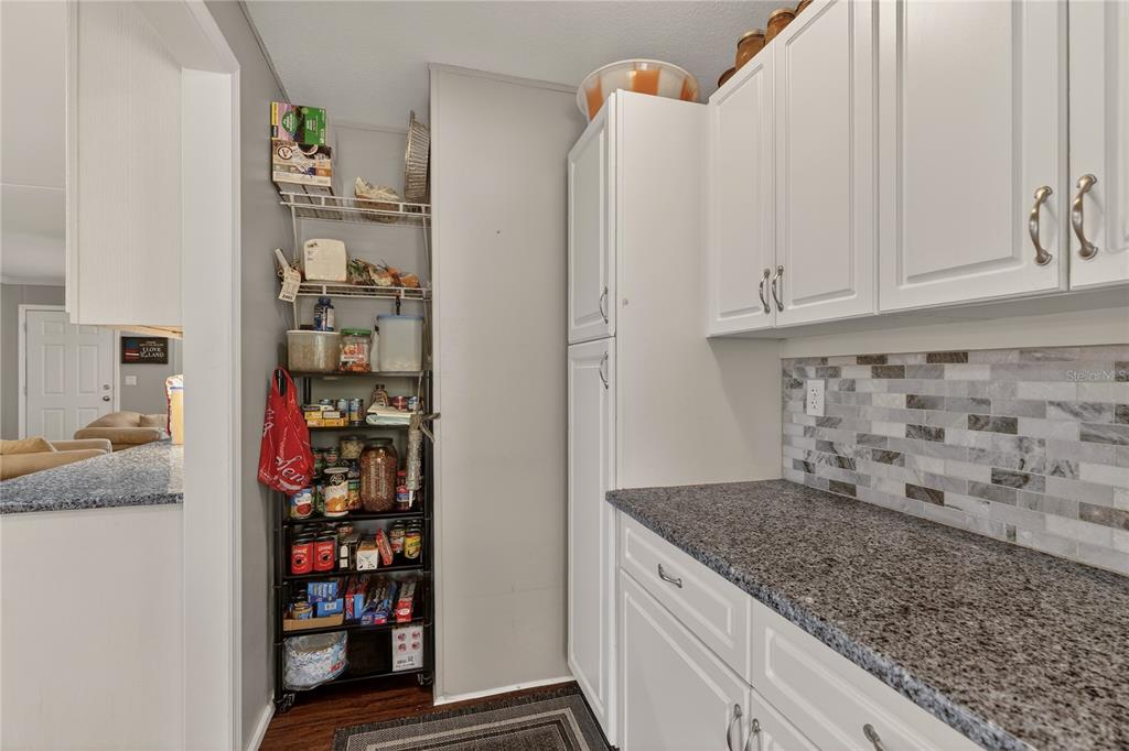 6249 South Esmeralda Terrace Lecanto, FL 34461 - Photo 19 of 61 a kitchen with stainless steel appliances granite countertop a refrigerator and a sink