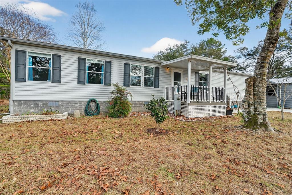 6249 South Esmeralda Terrace Lecanto, FL 34461 - Photo 2 of 61 a front view of a house with garden