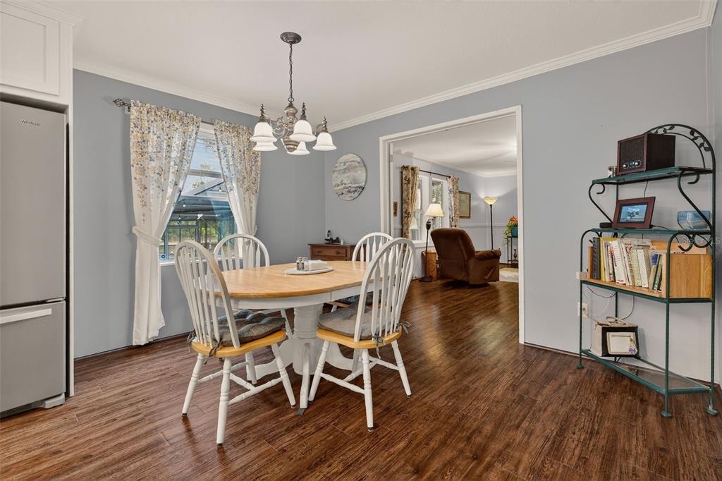 6249 South Esmeralda Terrace Lecanto, FL 34461 - Photo 21 of 61 a view of a dining room with furniture window and wooden floor