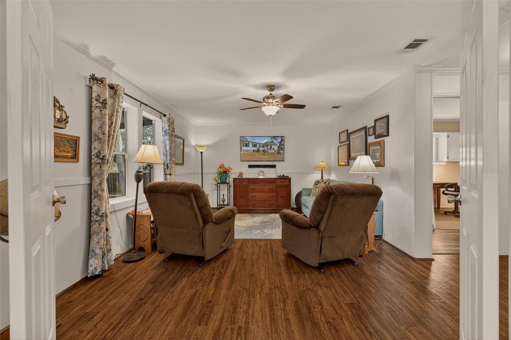 6249 South Esmeralda Terrace Lecanto, FL 34461 - Photo 23 of 61 a living room with furniture and a fireplace