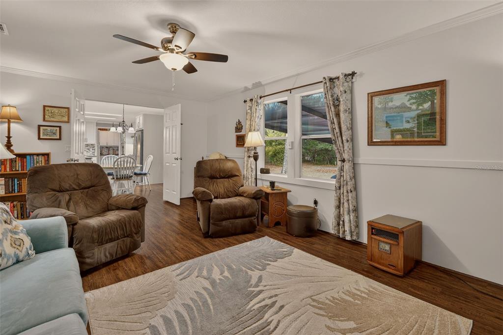 6249 South Esmeralda Terrace Lecanto, FL 34461 - Photo 25 of 61 a living room with furniture ceiling fan and a window