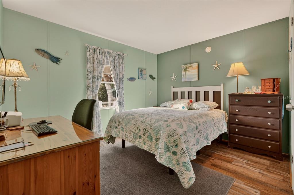 6249 South Esmeralda Terrace Lecanto, FL 34461 - Photo 28 of 61 a bedroom with a bed and wooden floor
