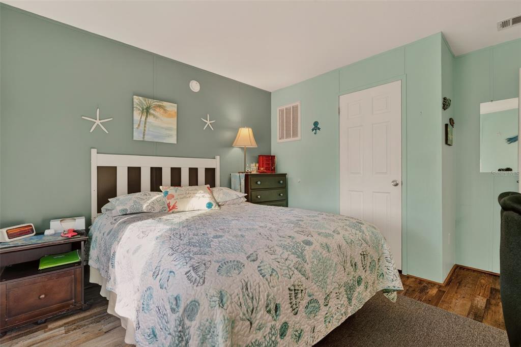 6249 South Esmeralda Terrace Lecanto, FL 34461 - Photo 29 of 61 a bedroom with a bed and a mirror