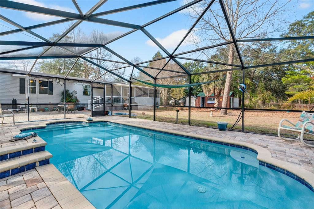 6249 South Esmeralda Terrace Lecanto, FL 34461 - Photo 3 of 61 a view of a swimming pool with a patio